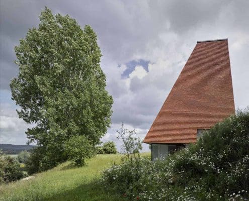 Part of Caring Wood estate, inspired by a traditional oast house using handmade roof tiles