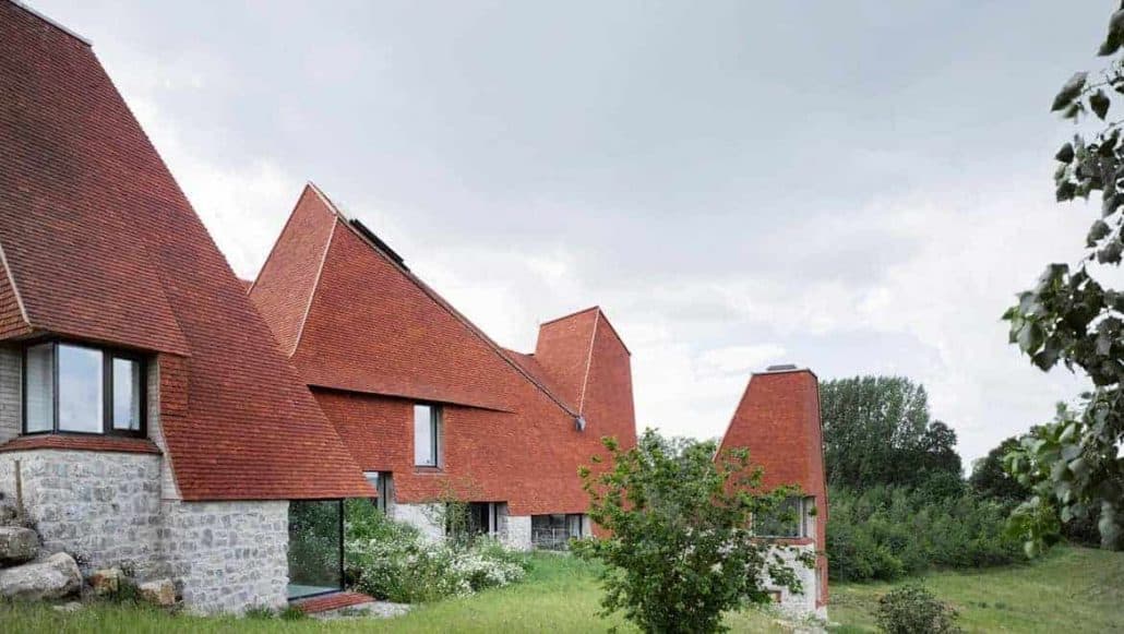 Side view of Caring Wood, winner of RIBA 2017 House of the Year award with stunning handmade roof tiles